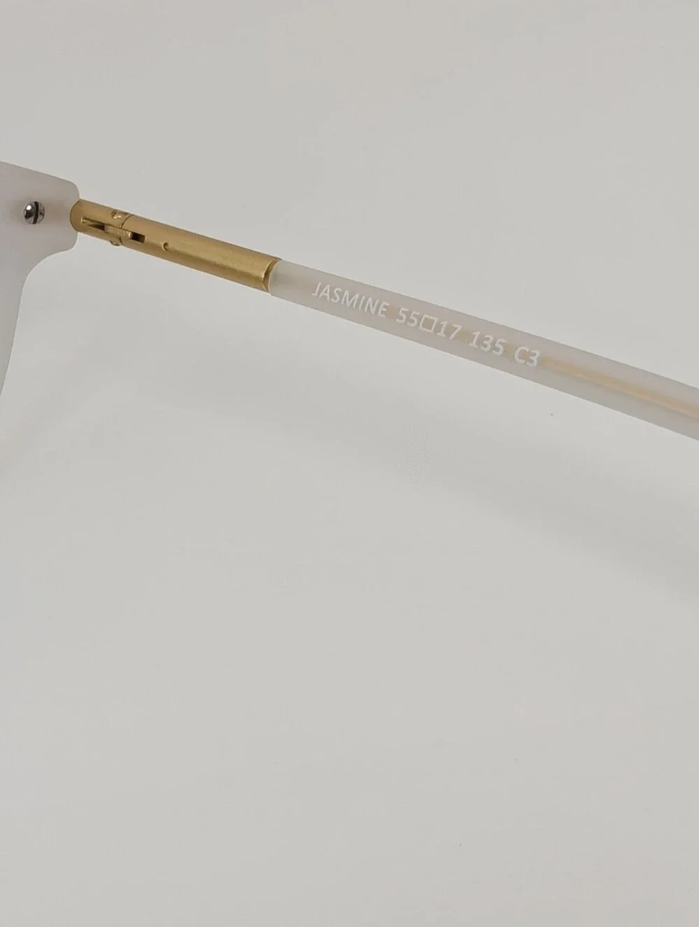 Cylinder. Women's Frosted White Round Frame Glasses. Cylinder Gold Highlights.